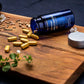 Protandim NRF2 caplets and bottle close up showing dietary supplement for oxidative stress support