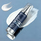 Facial cream bottle with blue label on a light gray background